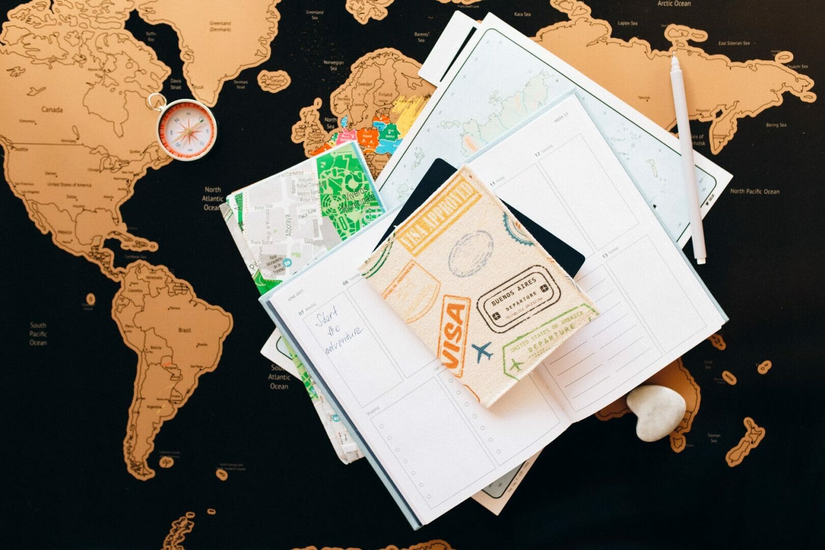 passport on top of a planner - Things to do Before Moving to Germany from India