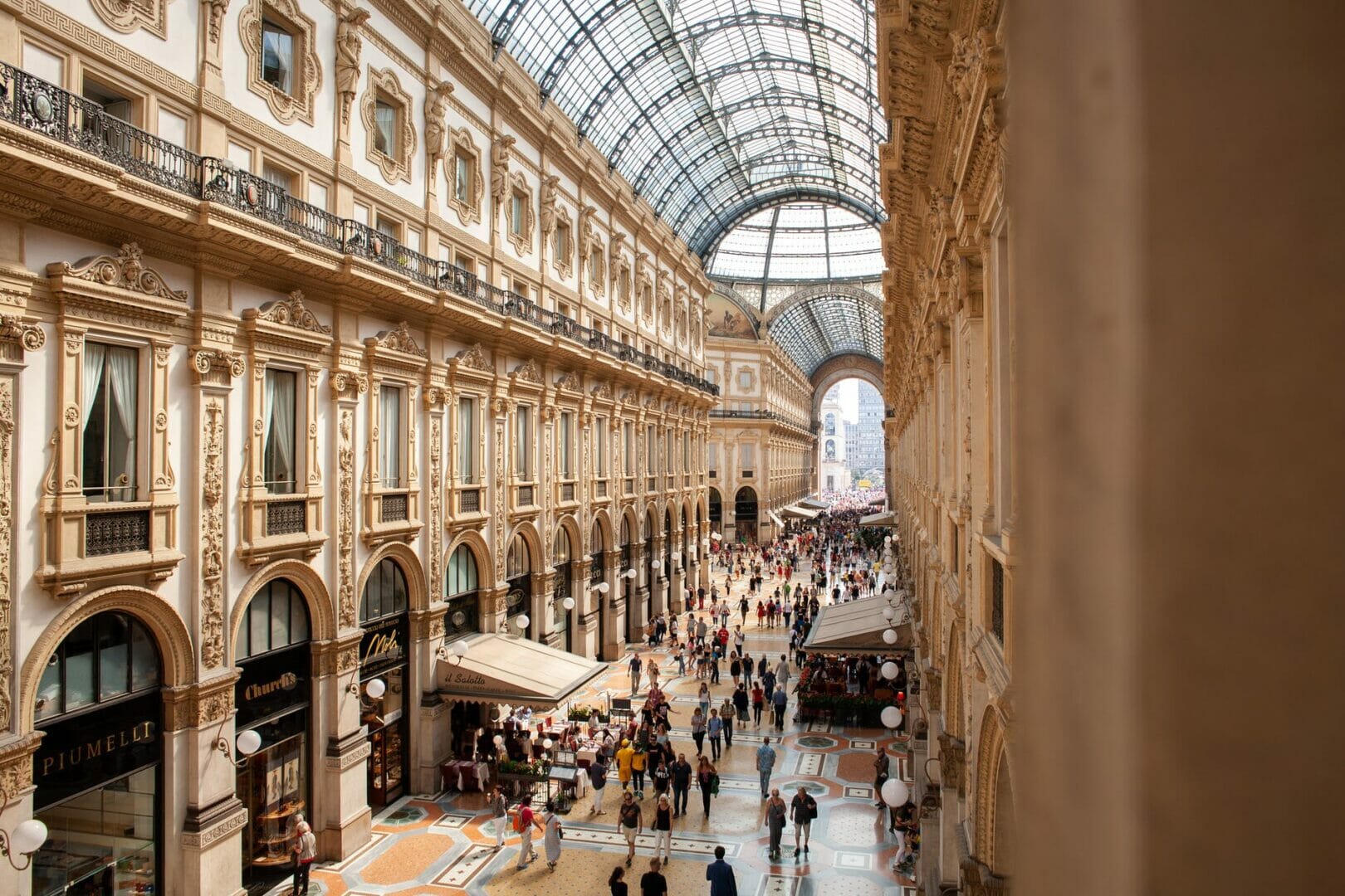 people inside galleria vittorio emanuele ii shopping mall in italy - Top Things to do in Milan Italy