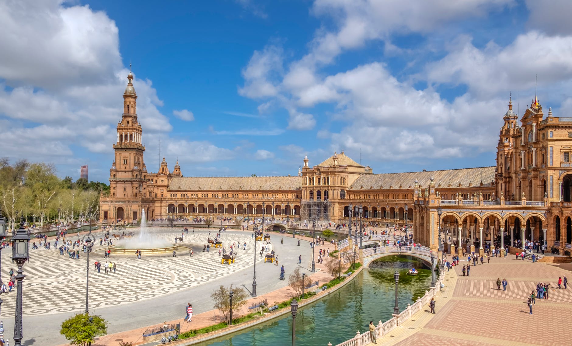 scenic view of spain square under blue sky with white clouds at daytime Best Places to visit in Spain in Summer 