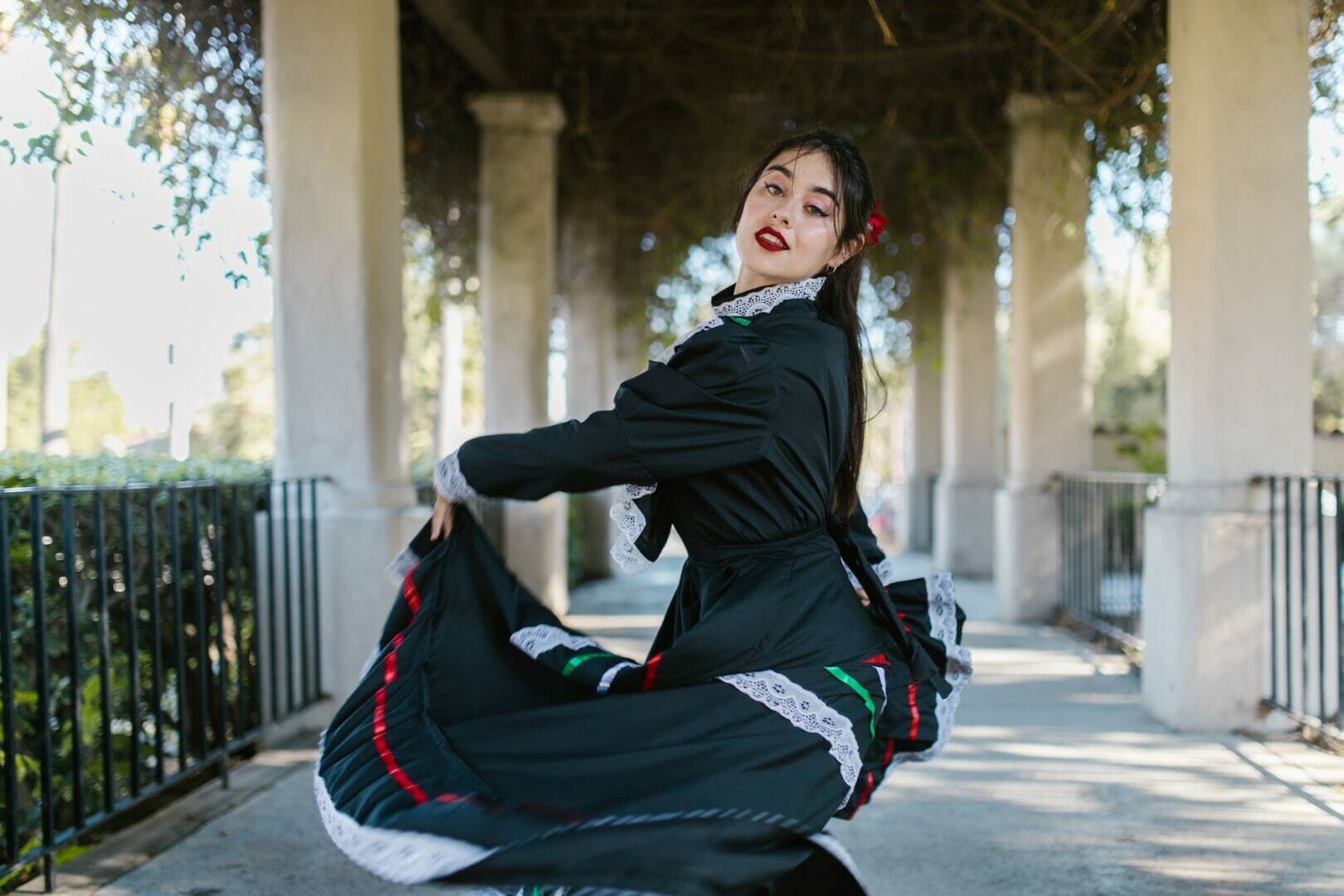 woman in black flamenco dress dancing